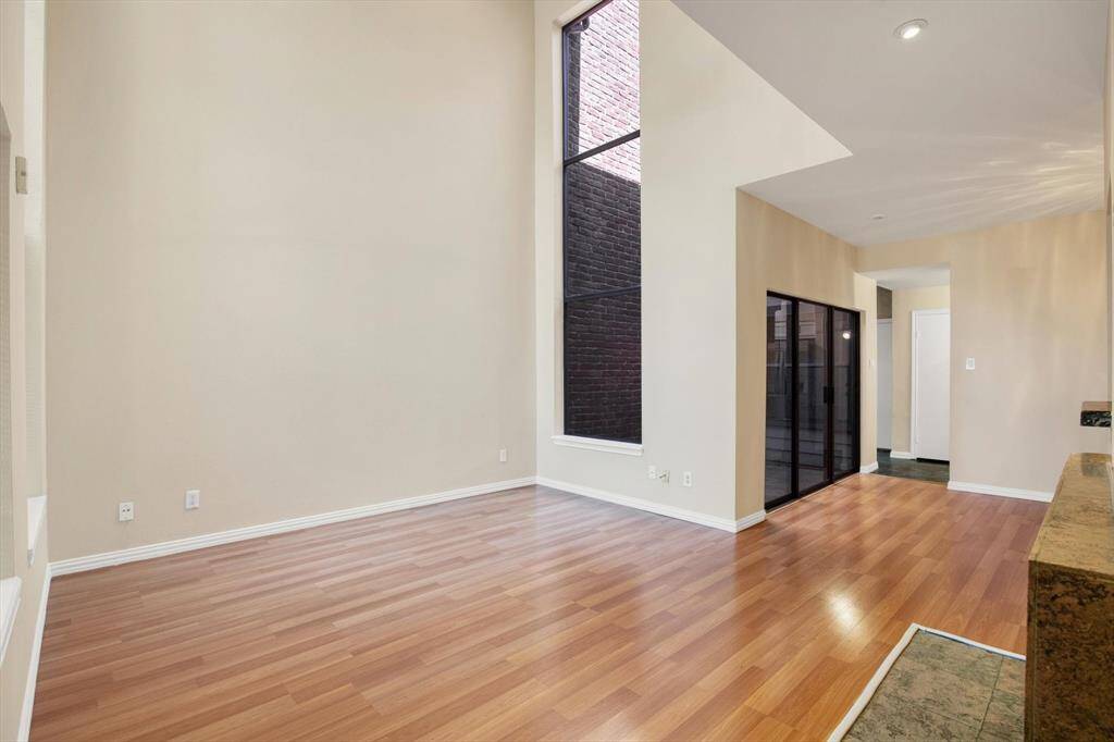 Open floor plan with two story windows