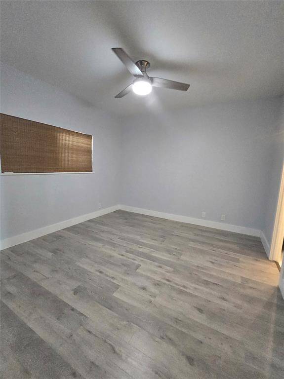 The primary bedroom measures 12'10" x 11'8" and features an ensuite bath, ceiling fan, and easy-to-maintain deluxe vinyl flooring