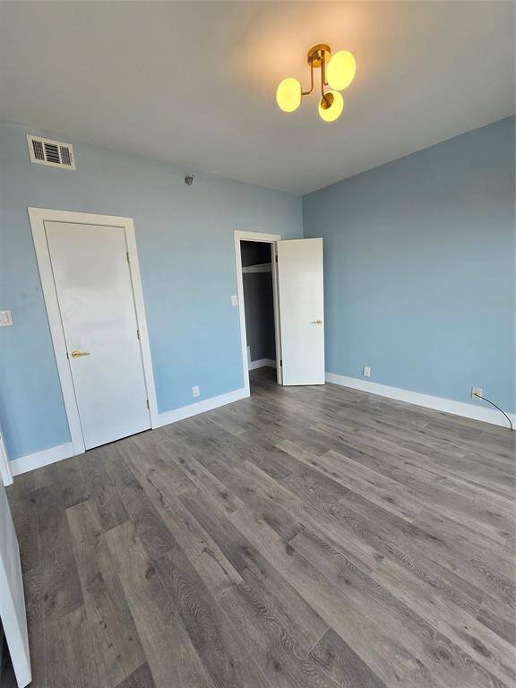 Second bedroom 11'9"x11'6" has sliding door to Gulf-view balcony.  It features an ensuite bath and walk-in closet.