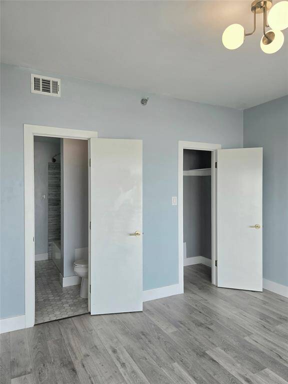 Second bedroom 11'9"x11'6" has sliding door to Gulf-view balcony.  It features an ensuite bath and walk-in closet.