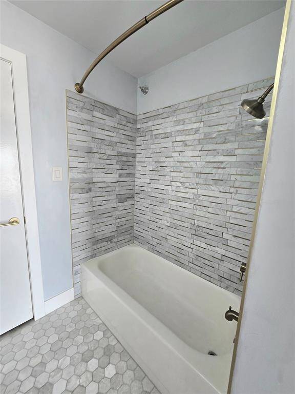 2nd bath has full-sized tub/shower with updated tile surround