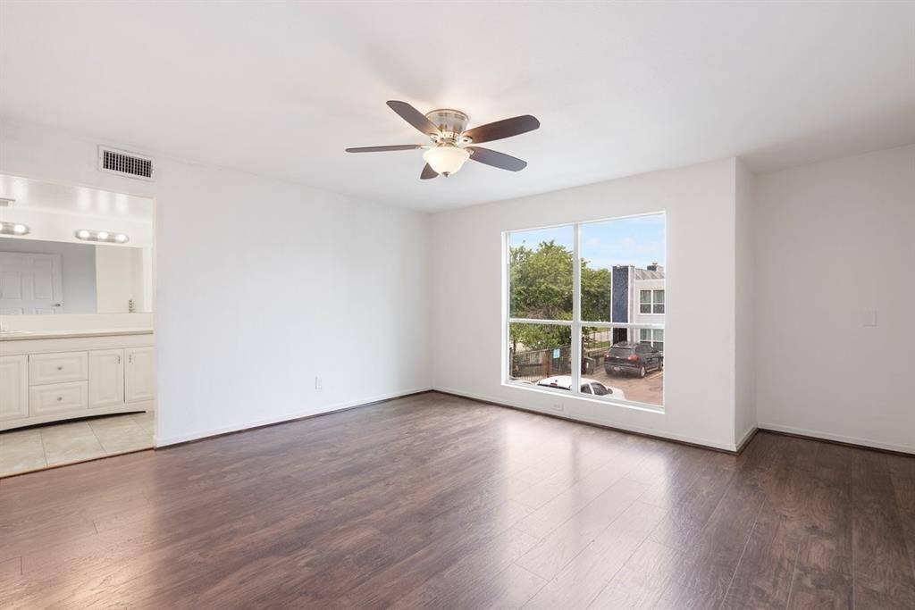 The primary bedroom is perched on the second floor and offers plenty of space for your personal items!