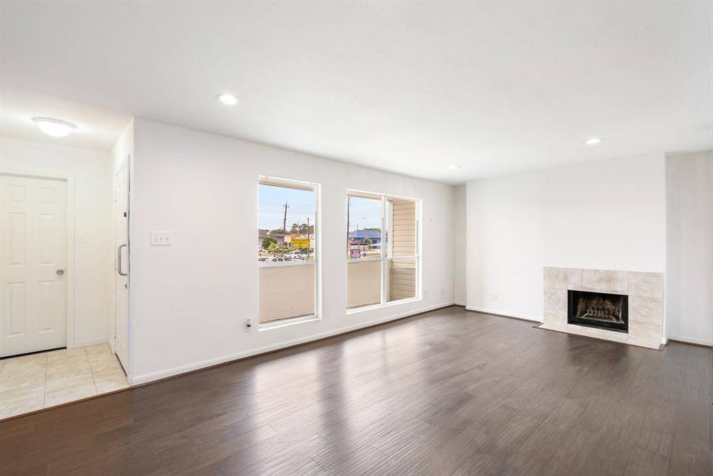 As soon as you enter, you will be amazed by the rich colored flooring and cozy fireplace!