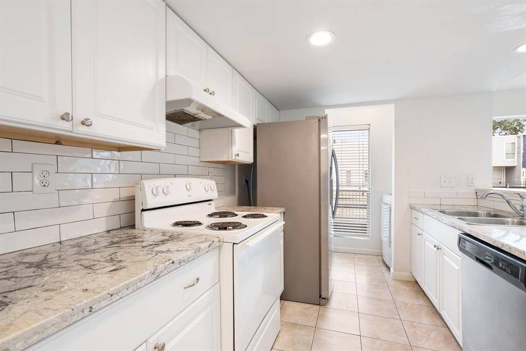 The kitchen has two pantries and lots of storage space! The washer and dryer room is conveniently located by the kitchen!