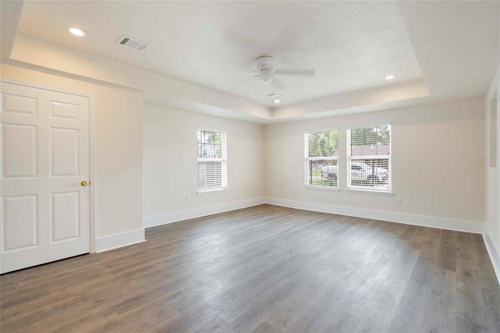 Luxurious primary suite featuring spacious interiors, abundant natural light, and stylish finishes, perfect for relaxation and comfort.
