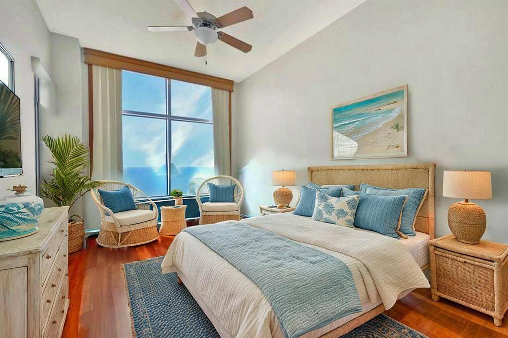 Spacious primary bedroom with elegant wood flooring, soaring 11' 4" ceilings, and a large window leading to balcony access. Enjoy privacy with room-darkening shades and custom wood cornice. (AI photo)
