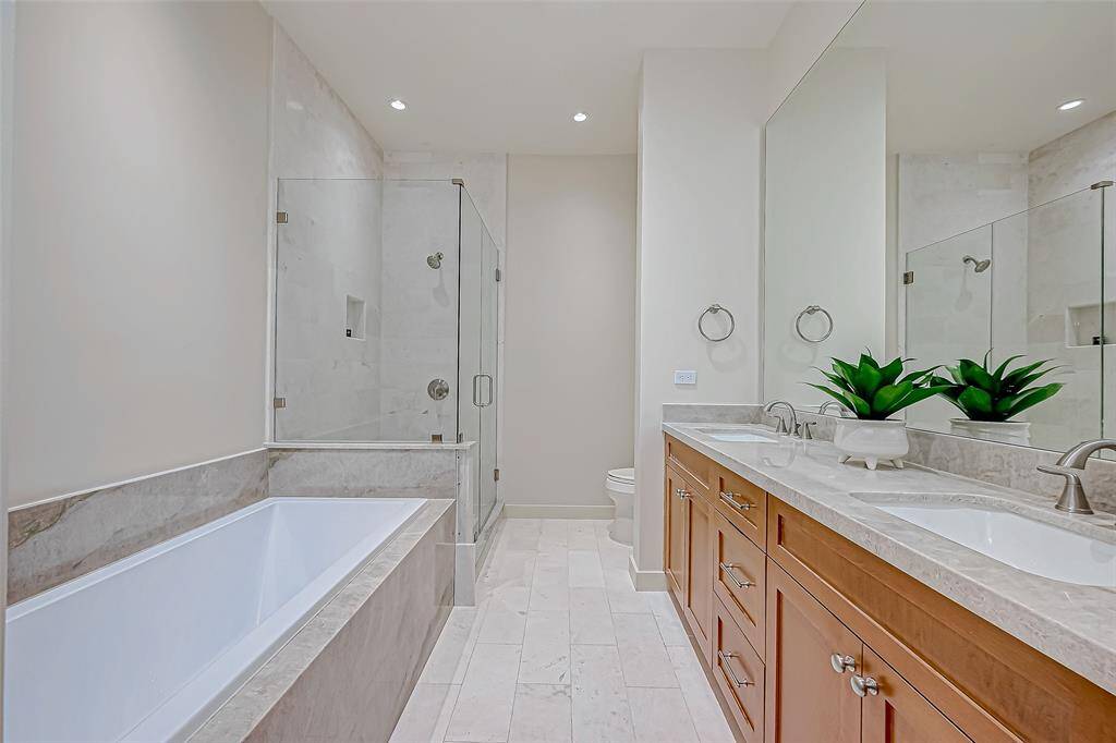 Luxurious remodel with premium finishes! Brand-new master bath featuring custom cabinetry, countertops, elegant lighting, and flooring.
