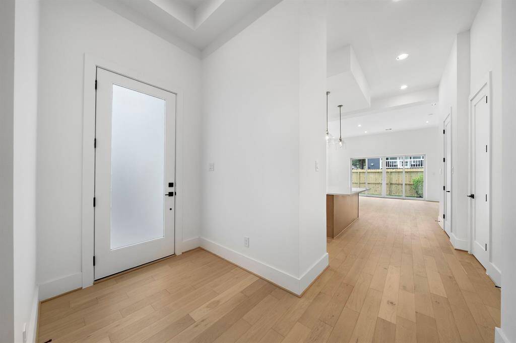 As you enter, you will notice spacious open concept living with amazing natural light and quality finishes throughout. (Photo is of a previously completed home.)