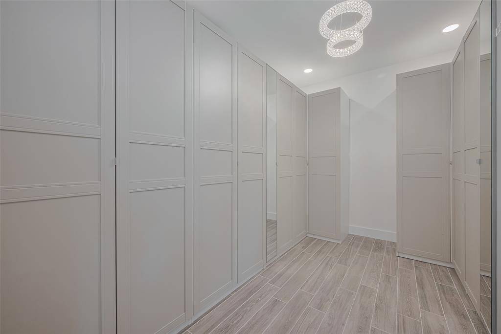 Primary High End walk in closet with tons of space