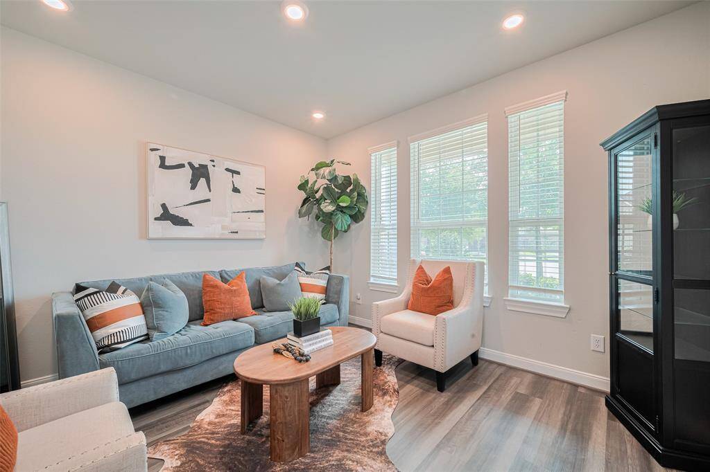 This inviting living room features large windows.