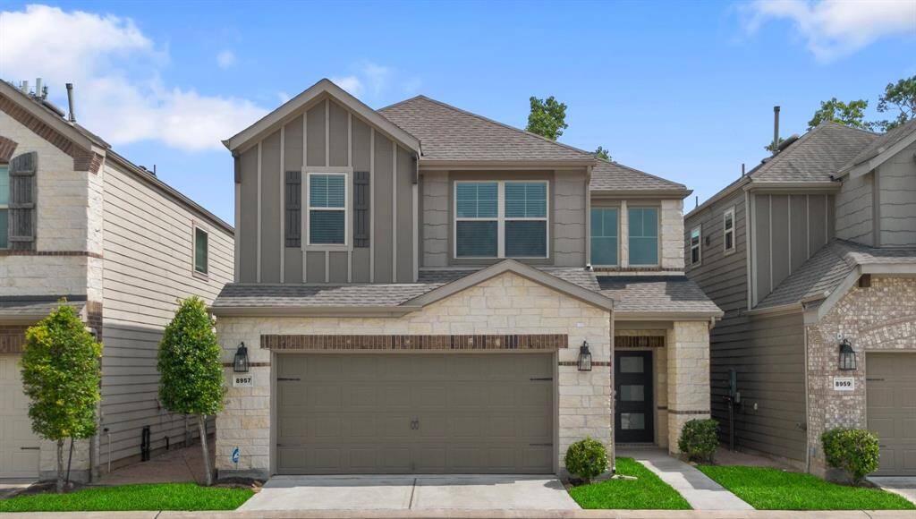 Charming curb appeal with stone, brick, and batten board siding along a beautifully manicured, tree-lined street, nestled in the heart of Spring Branch, just minutes from I-10.