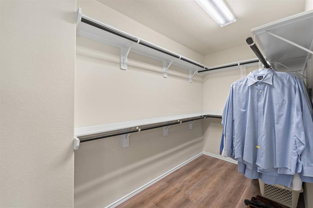 Large walk-in closet with double-level hanging space and room for seasonal storage—designed for real functionality.
