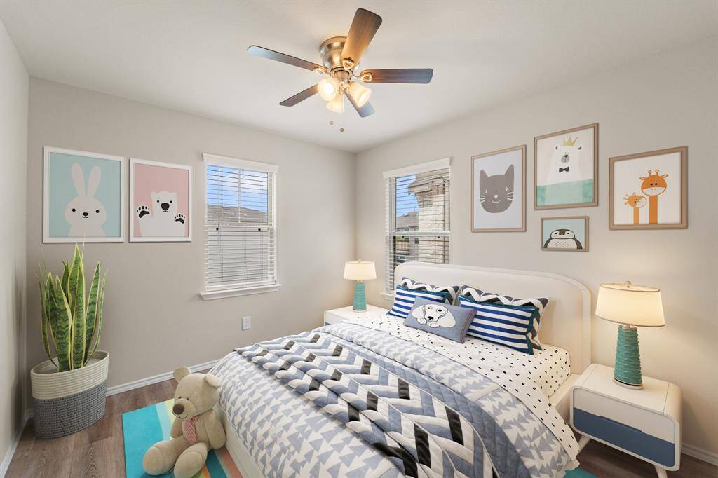 Charming secondary bedroom with double windows and room to grow—perfect for a nursery, playroom, or creative space. *Virtually Staged*