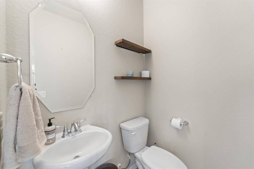 Located on the first floor, off the flex space, is the spacious powder room.