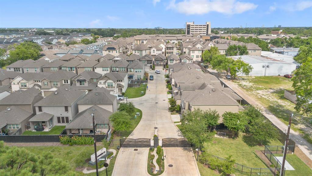 GATED ENTRANCE - Controlled access welcomes residents and guests. DOG PARK - Located to the right of the entrance.