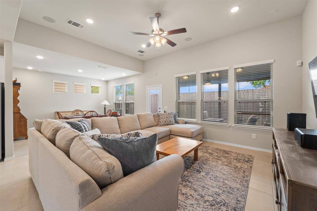 Comfortable and inviting living space with backyard views, ample natural light, and room to spread out—perfect for relaxing or hosting.