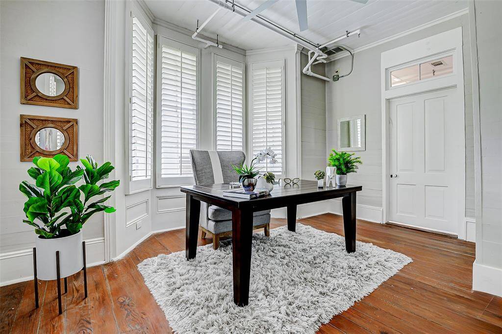 This room to the left of the foyer could serve as the primary bedroom, study, living, etc.