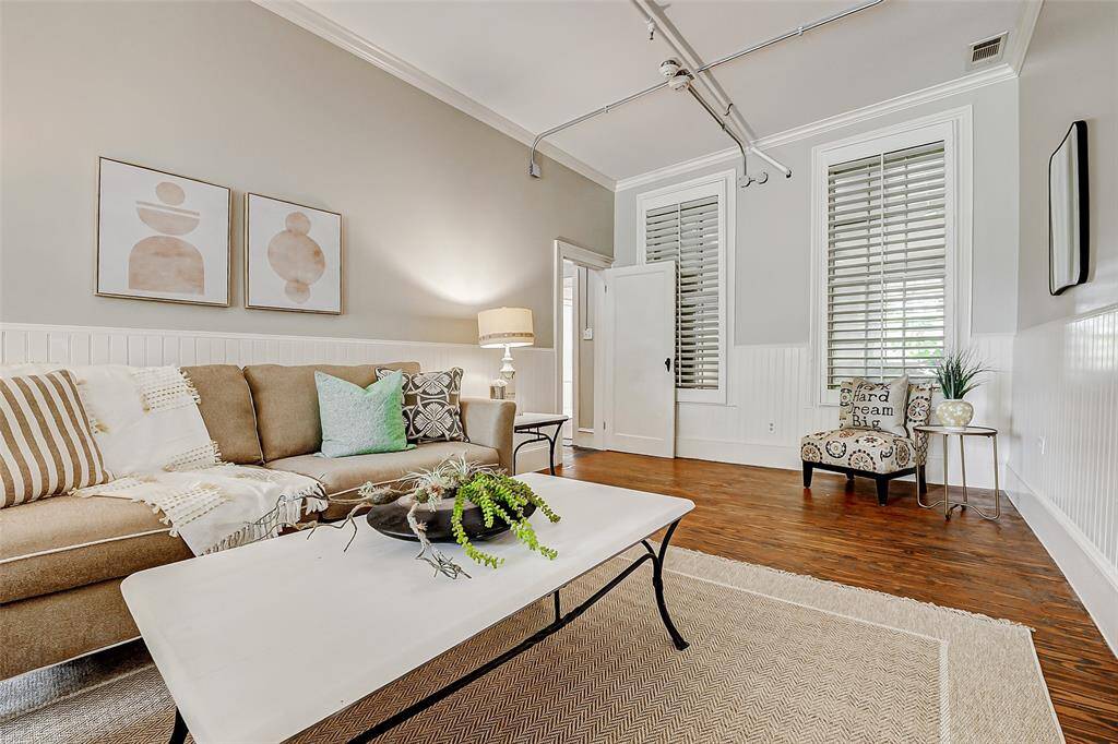 This spacious 11x23 room, conveniently located just off the kitchen, is ideal for use as a sitting room, family room, or dining area—perfect for accommodating a large table. The walls are adorned with elegant wainscoting, adding a touch of timeless charm to the space.