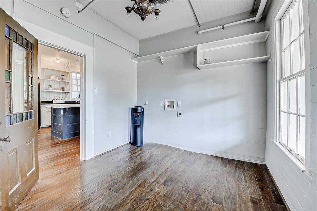 This spacious laundry room offers ample space for all your laundry needs.