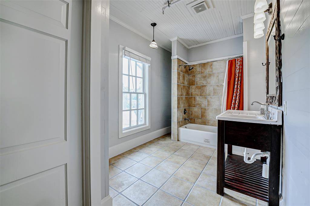 Located upstairs, this full bath is conveniently located near one of several bedrooms.