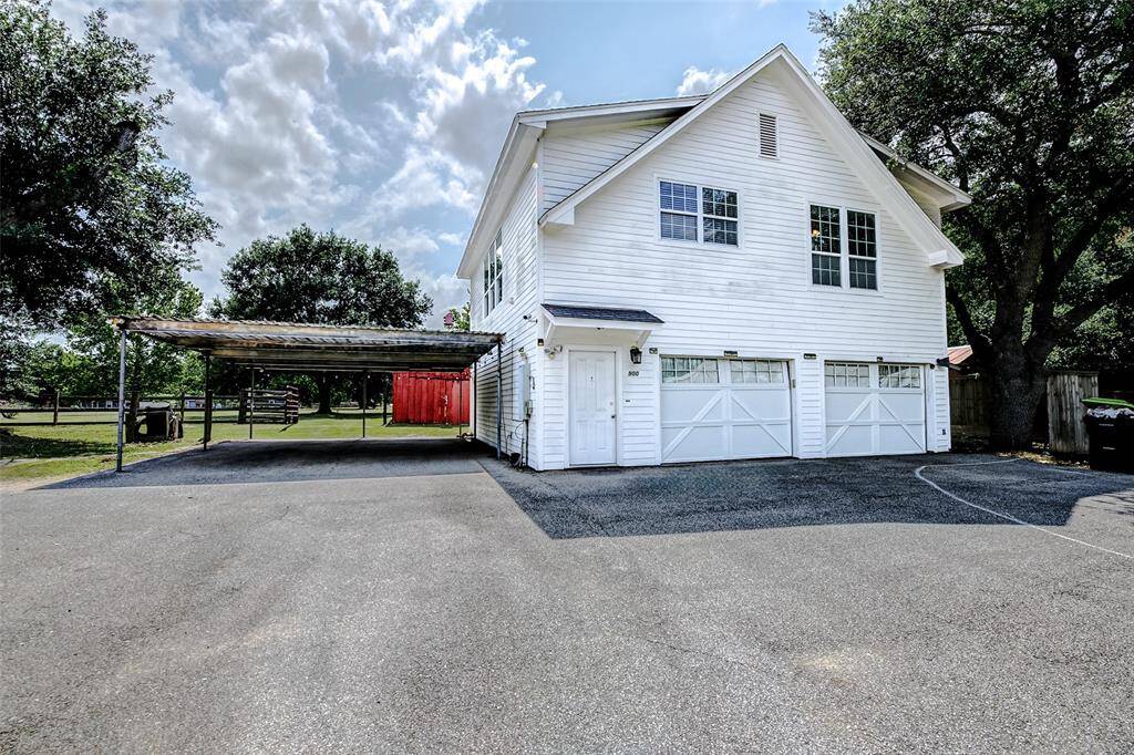 This property offers income-producing potential or guest quarters! The door leads to a spacious, 900+ SF apartment with two bedrooms, full bath, and granite island kitchen. The spacious, oversized garage includes a sink and extensive shelving.