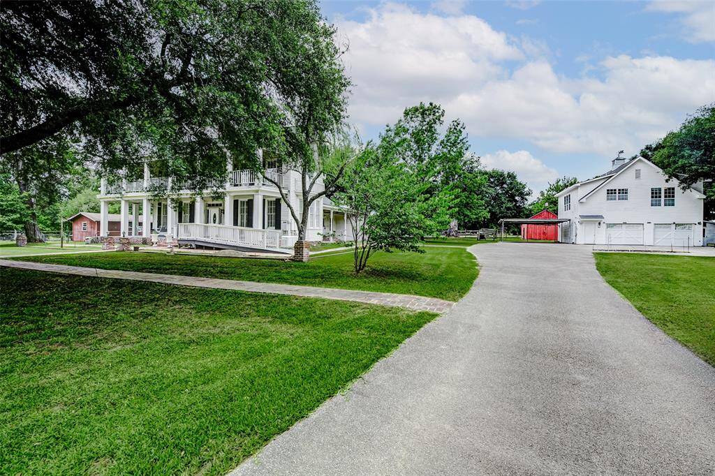 Set back off the road, this spectacular property offers plenty of parking for whatever your needs.