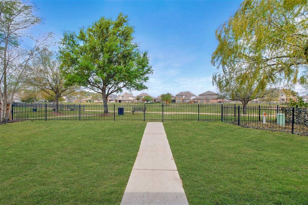 Lake-side home offers private gate with direct access to walking trails and catch & release fishing lake.