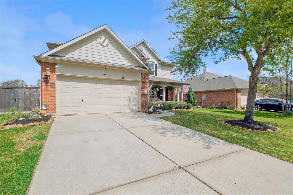 Double driveway and 2-car garage are perfect for those extra guests.