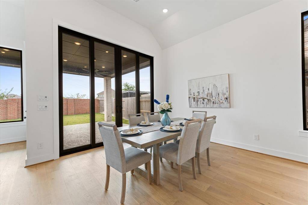 Positioned with a serene backyard view for a peaceful dining experience.Easy outdoor access lets fresh air flow in, enhancing every meal.