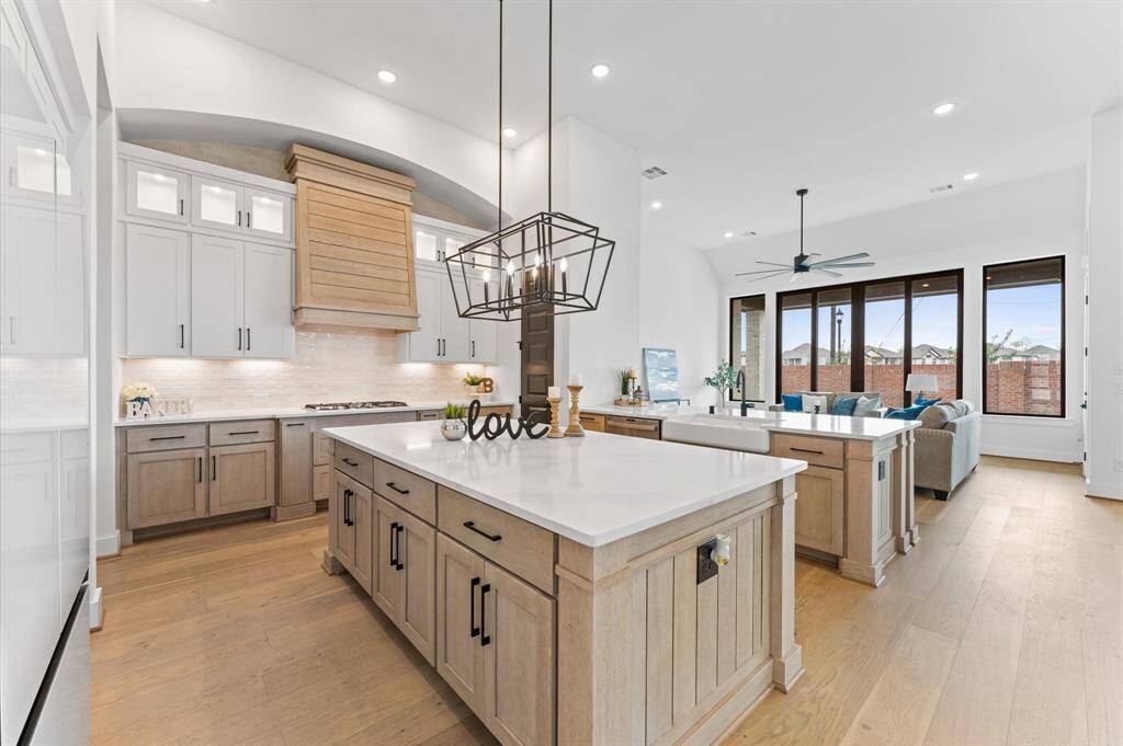 A chef’s dream with a massive island perfect for gathering and meal prep.