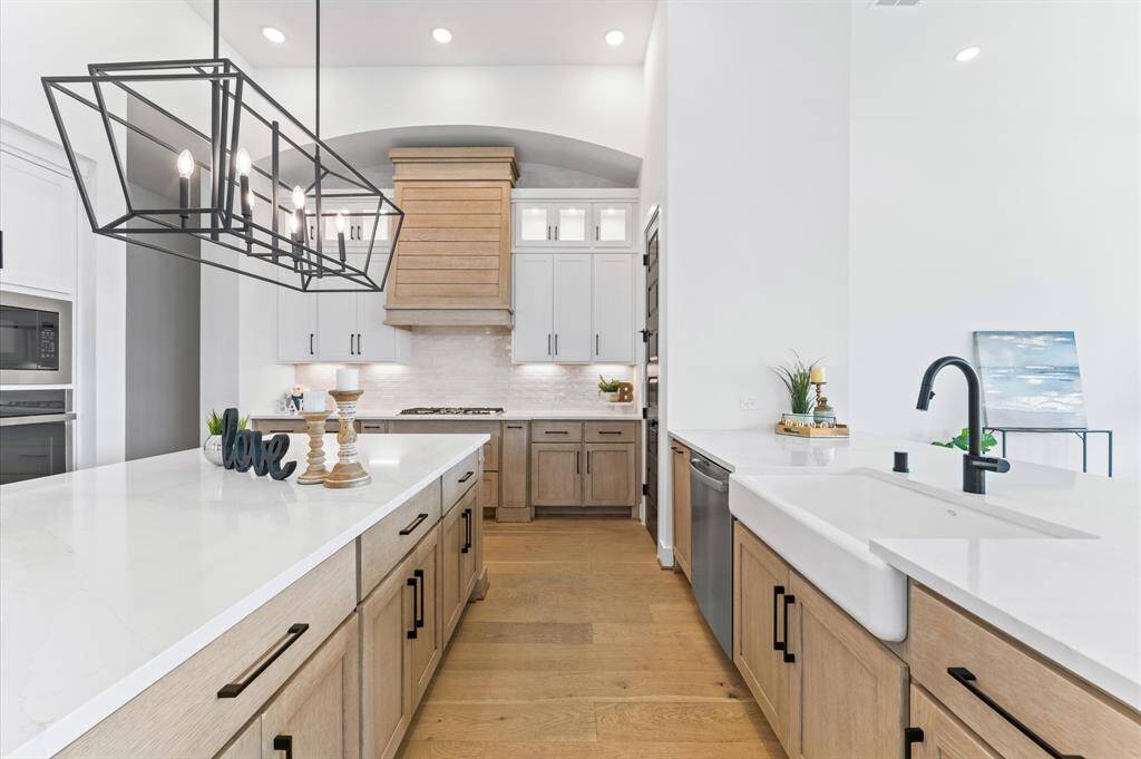 Custom cabinets with underlighting create a warm and inviting ambiance.
