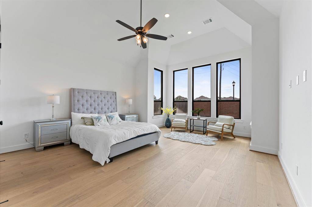 The Master's bedroom is a restful retreat with oversized windows that welcome natural light.