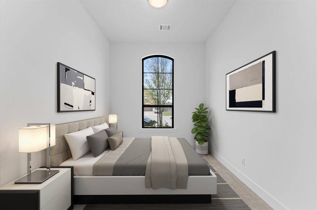 Spacious second bedroom filled with natural light, perfect for rest and relaxation. Soft carpeting adds comfort, making it a cozy retreat at the end of the day