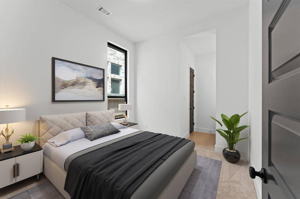 A bright and airy fourth bedroom with plenty of space for all your needs.Neutral tones and soft carpeting provide a calm, restful ambiance.