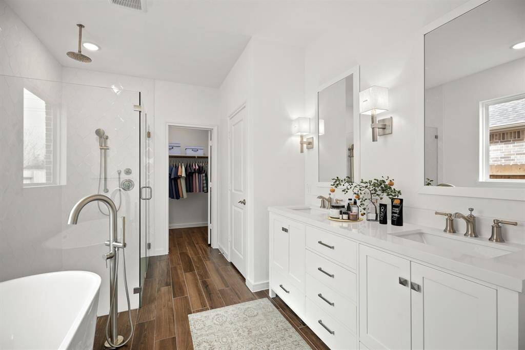 Luxurious primary bath with dual sinks (*Photo not of actual home and used for illustration purposes only.)