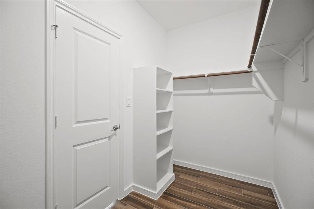 Walk-in closet in primary suite (*Photo not of actual home and used for illustration purposes only.)