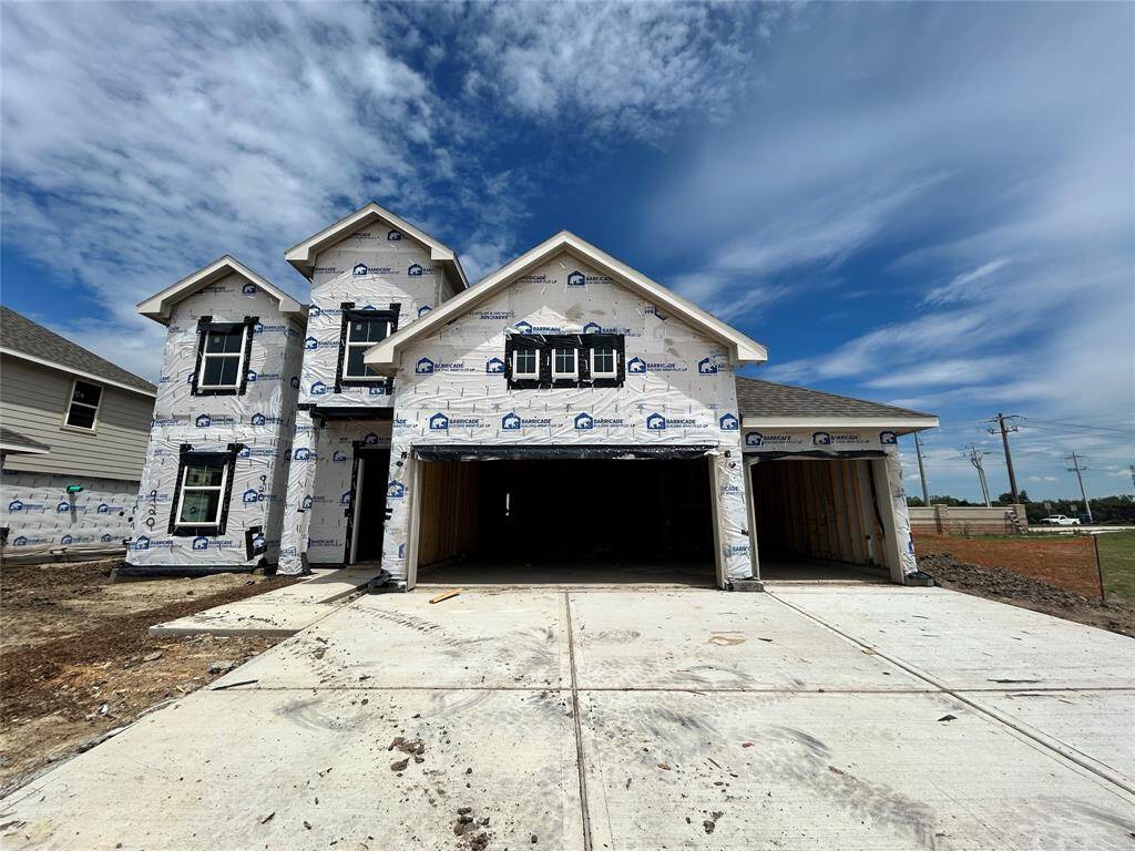 Two story home with 4 bedrooms, 3.5 baths, and 3 car garage.