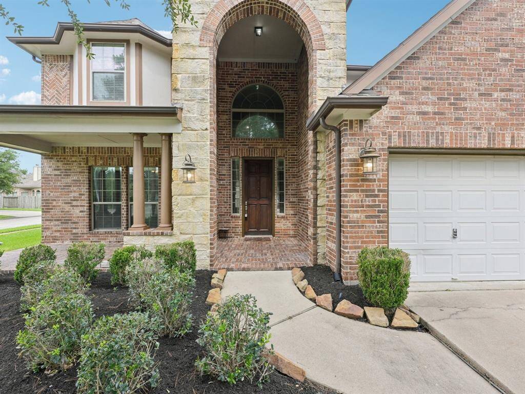 This gorgeous home features a stone and brick front elevation that is sure to please.