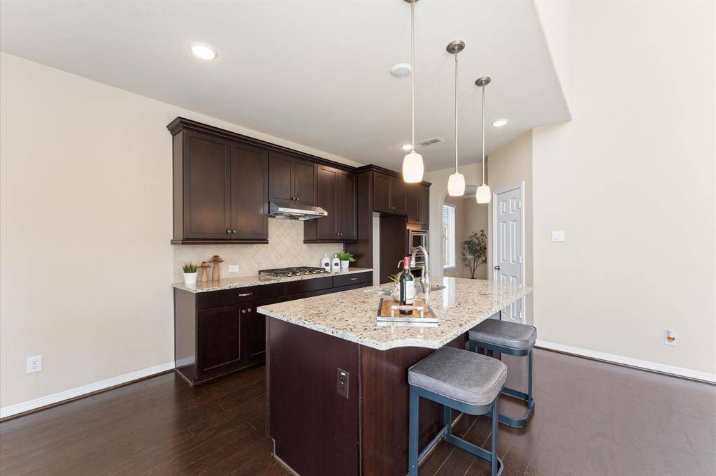 Cabinets offer beautiful storage and thoughtful design touches.