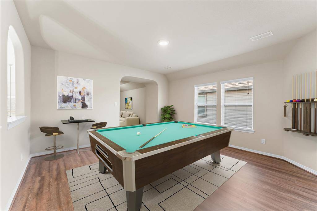 The upstairs game room is ready for family fun and endless playtime.
