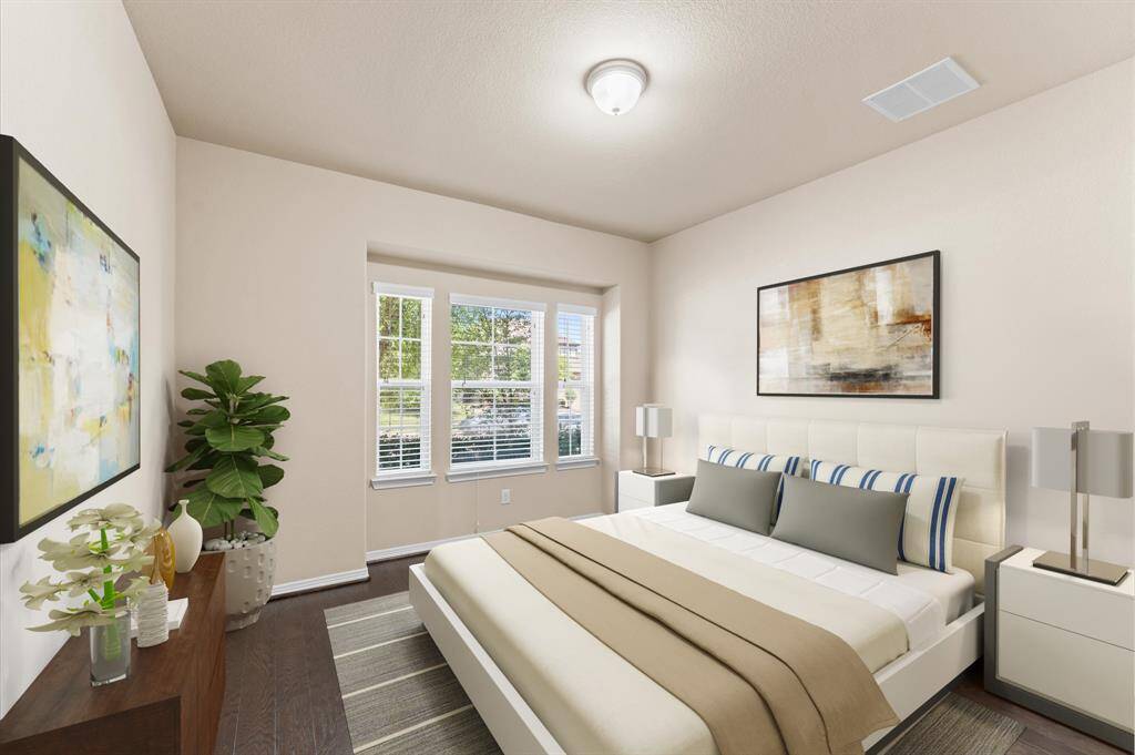 This bright second bedroom welcomes the morning sun through wide windows. Soft tones and a peaceful atmosphere make it perfect for rest or quiet study.