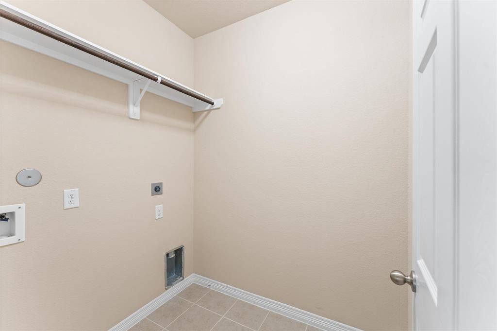 The laundry area is thoughtfully placed for convenience and ease. It’s a quiet corner that makes household tasks feel a little lighter.