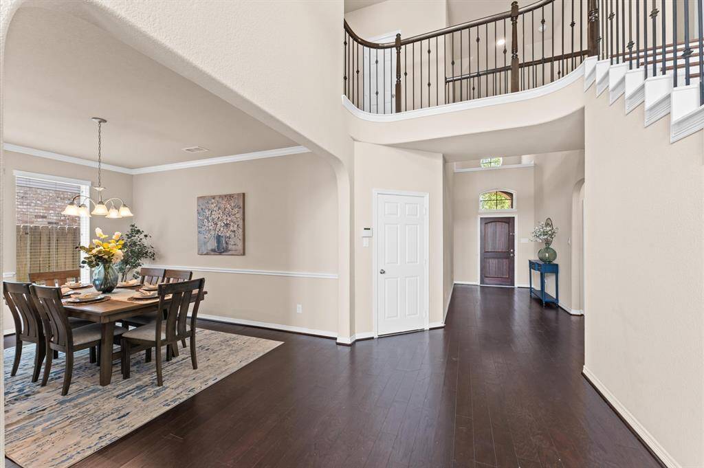 The gentle flow guides you toward the formal dining room, where elegant touches and natural light create a picture-perfect setting.