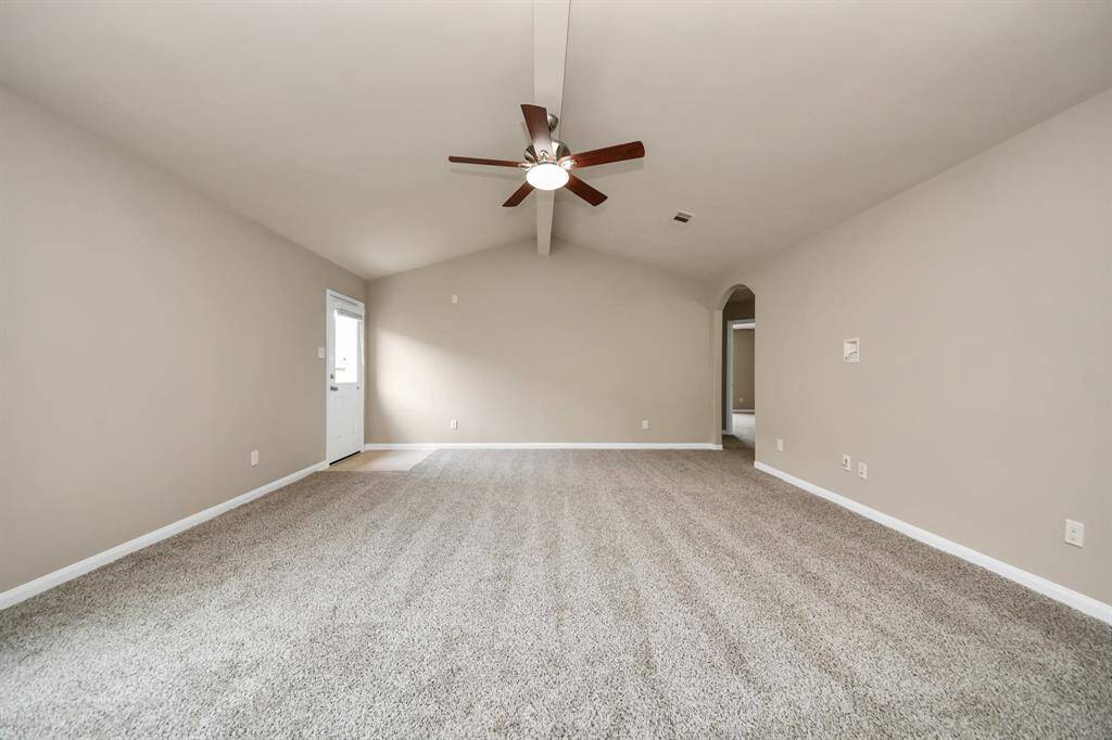 Vaulted ceilings and natural light bring in comfort and class to the living room.