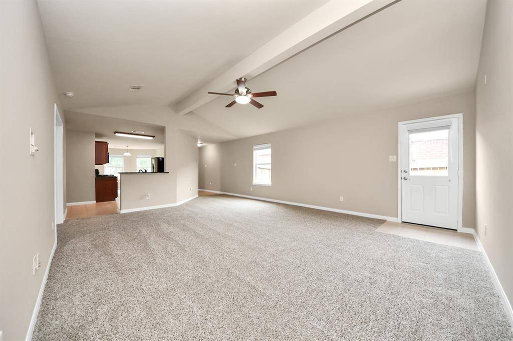 Spacious living room with lots of wall space to design your dream gathering space.