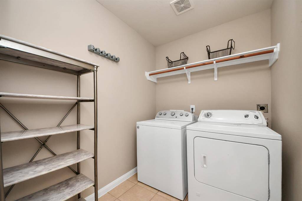 The laundry room is tucked away, but has plenty of space.