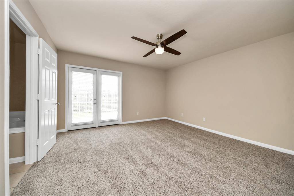 Primary Bedroom with private entry from the backyard and its very own ensuite bathroom