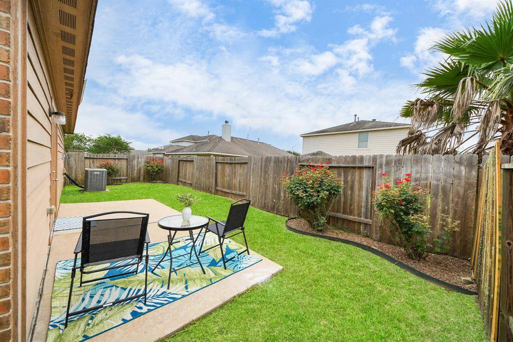 Fully fenced backyard with double patio for entertaining and relaxing.