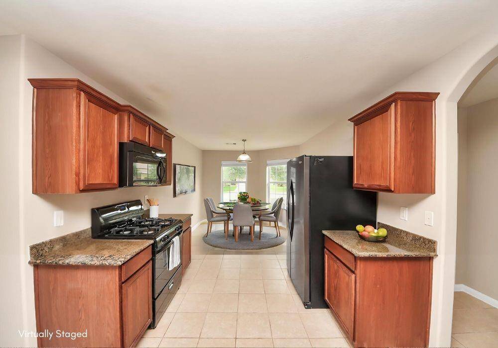 Virtually staged Kitchen/Dining combo to show possible design options.