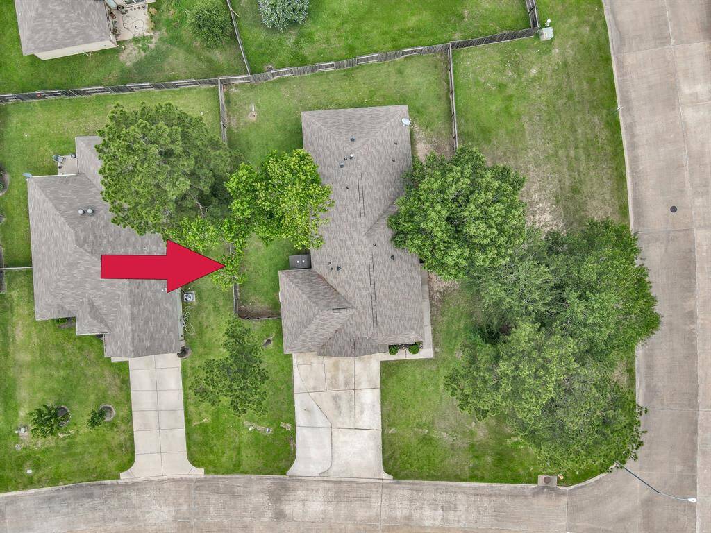Placed on the Corner - the Homeowner tells me the City of Conroe owns the space between the property and the street.